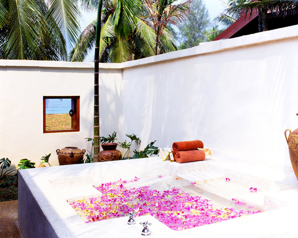 A spa bath strewn with flowers at Tanjong Jara Resort Malaysia